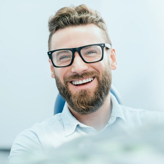 man smiling in dental chair