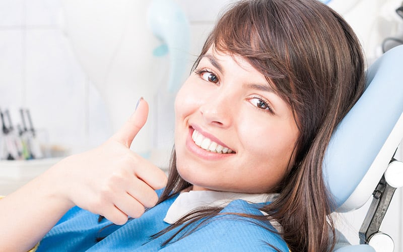 woman smiling in dental chair